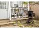 Cozy patio with black and white seating and vintage stove at 6379 Monitor Dr, Indianapolis, IN 46220