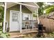 Charming backyard shed featuring cozy patio with black and white seating and vintage stove at 6379 Monitor Dr, Indianapolis, IN 46220