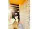 Functional bathroom featuring shower with floral print curtain, shelves, and fixtures at 6546 Derbyshire Rd, Indianapolis, IN 46227