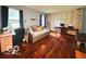 Spacious bedroom with hardwood floors, ample natural light, and a versatile layout with office space at 6546 Derbyshire Rd, Indianapolis, IN 46227