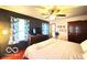 The bedroom features a ceiling fan and is lit with natural light at 6546 Derbyshire Rd, Indianapolis, IN 46227