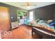 Bedroom with twin beds, hardwood floors, ceiling fan, closet, and window with natural light at 6546 Derbyshire Rd, Indianapolis, IN 46227