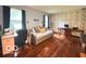 Home office with hardwood floors, daybed, and bright window at 6546 Derbyshire Rd, Indianapolis, IN 46227