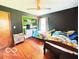 This bedroom features two twin beds and built-in shelving at 6546 Derbyshire Rd, Indianapolis, IN 46227