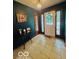 The entryway features dark green walls, a wooden table, and tile floors at 6546 Derbyshire Rd, Indianapolis, IN 46227