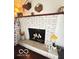 Cozy fireplace featuring white-painted brick, decorative accents, and a charming, inviting atmosphere at 6546 Derbyshire Rd, Indianapolis, IN 46227