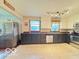 Spacious kitchen featuring tile floors, two-tone cabinets, and stainless steel appliances at 6546 Derbyshire Rd, Indianapolis, IN 46227