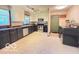 Functional kitchen area with modern appliances, great counter space, and an adjacent laundry area at 6546 Derbyshire Rd, Indianapolis, IN 46227
