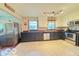 Well-equipped kitchen with stainless steel appliances, modern cabinetry, and a functional layout for cooking at 6546 Derbyshire Rd, Indianapolis, IN 46227