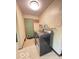 Functional laundry room with modern washer and dryer, a utility sink, and ample storage space at 6546 Derbyshire Rd, Indianapolis, IN 46227
