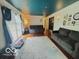 Comfortable living room with plush sofas, area rug, and sliding glass doors at 6546 Derbyshire Rd, Indianapolis, IN 46227