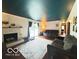 Comfortable living room featuring a brick fireplace, hardwood floors, and sliding glass doors to the outside at 6546 Derbyshire Rd, Indianapolis, IN 46227
