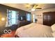 Main bedroom with hardwood floors, overhead fan, and closet at 6546 Derbyshire Rd, Indianapolis, IN 46227