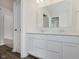 Bathroom features a double sink vanity with white cabinets and granite countertop, plus a shower at 7282 Shroyer Way, Noblesville, IN 46062