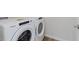Laundry room equipped with a new white Whirlpool washer and dryer at 7282 Shroyer Way, Noblesville, IN 46062