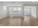 Bright, open living room with hardwood floors and large windows at 7282 Shroyer Way, Noblesville, IN 46062