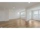 Spacious living room with hardwood floors and natural light from ample windows at 7282 Shroyer Way, Noblesville, IN 46062