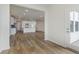 Open concept showcasing the kitchen and living room layout with hardwood flooring throughout at 7282 Shroyer Way, Noblesville, IN 46062