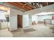Unfinished basement with exposed ceiling, washer, dryer, and ample space for customization at 7303 W Division Rd, Bargersville, IN 46106