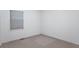 Neutral bedroom with light-colored carpet, window with blinds, and white walls at 7303 W Division Rd, Bargersville, IN 46106
