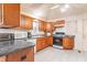 Kitchen featuring wood cabinets, stainless steel appliances, and a tile floor at 7303 W Division Rd, Bargersville, IN 46106