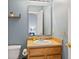 Bathroom featuring blue paint, wood vanity, and a classic faucet at 772 Cembra Dr, Greenwood, IN 46143
