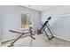 Bright bedroom featuring exercise equipment, neutral carpet, and a sunny window view at 772 Cembra Dr, Greenwood, IN 46143