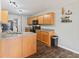 Well-appointed kitchen featuring wood cabinets, matching countertops and a black appliance package at 772 Cembra Dr, Greenwood, IN 46143