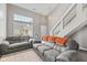 Bright living room with high ceilings, hardwood floors and neutral paint at 772 Cembra Dr, Greenwood, IN 46143