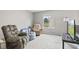 Living room filled with cozy seating and a view to the outdoors at 772 Cembra Dr, Greenwood, IN 46143