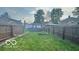 The spacious backyard is fully fenced in with a garden plot and pool at 909 Pearl St, Columbus, IN 47201
