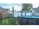 Backyard features an above ground pool and fenced in yard at 909 Pearl St, Columbus, IN 47201