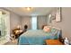 Spacious bedroom with a bed, side tables and ensuite bathroom at 909 Pearl St, Columbus, IN 47201