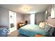 Bedroom with a bed, side tables and ensuite bathroom at 909 Pearl St, Columbus, IN 47201