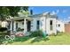 Charming home with a covered porch and well-maintained front yard at 909 Pearl St, Columbus, IN 47201