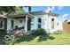 Charming home with a covered front porch and well-maintained landscaping at 909 Pearl St, Columbus, IN 47201