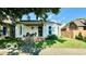 Charming single-story home featuring a welcoming front porch and well-maintained yard at 909 Pearl St, Columbus, IN 47201