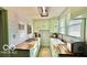 Galley kitchen featuring sleek butcher block countertops and a modern design at 909 Pearl St, Columbus, IN 47201