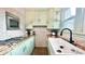 Charming kitchen features updated countertops, gas stove, and stainless steel appliances at 909 Pearl St, Columbus, IN 47201