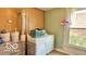 Functional laundry room features a washer, dryer, and ample space for sorting and folding at 909 Pearl St, Columbus, IN 47201