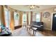 Comfortable living room with hardwood floors and lots of light from large windows at 909 Pearl St, Columbus, IN 47201