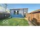 Outbuilding with windows and door in fenced in backyard at 909 Pearl St, Columbus, IN 47201