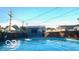 Backyard in-ground pool next to a modern outbuilding, with partial fencing at 909 Pearl St, Columbus, IN 47201