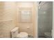This bathroom offers a toilet and shower combination and window with a decorative curtain at 10104 Sycamore Ln, Indianapolis, IN 46239