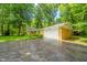 View of the house and long driveway leading to attached two-car garage at 10104 Sycamore Ln, Indianapolis, IN 46239