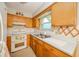 Traditional kitchen with ample cabinet space and white appliances at 10104 Sycamore Ln, Indianapolis, IN 46239