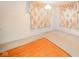 Spacious living room with a blend of hardwood and carpet, large windows, and a classic chandelier at 10104 Sycamore Ln, Indianapolis, IN 46239