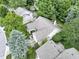 An aerial view showcases a home surrounded by lush greenery and neighboring residences at 1114 Clairborne Ct, Indianapolis, IN 46280