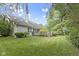 Beautiful backyard showcasing mature trees and a wooden deck, perfect for enjoying the outdoor space at 1114 Clairborne Ct, Indianapolis, IN 46280