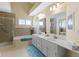 Bathroom with tiled shower, soaking tub, and double sink vanity at 1114 Clairborne Ct, Indianapolis, IN 46280